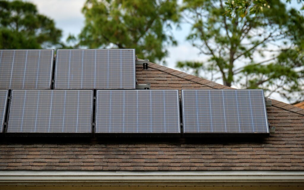 Residential house with rooftop covered with solar photovoltaic panels